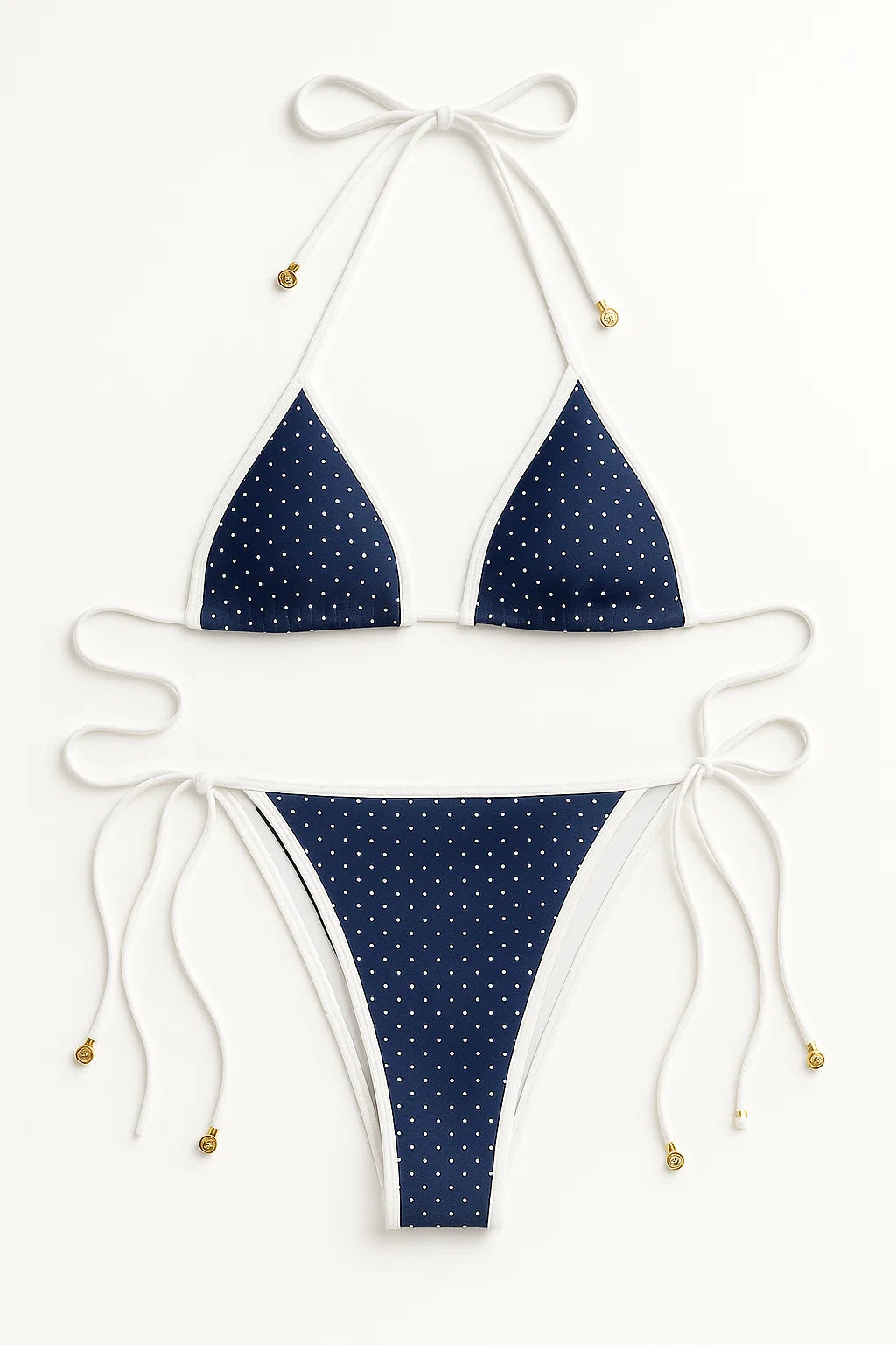 Navy blue bikini with white polka dots on a white background